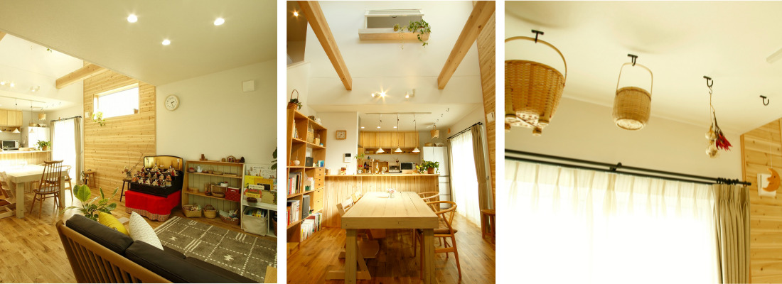 木の温もりに包まれたナチュラルテイストのLDKとダイニングスペース。吹抜けのある空間に無垢材テーブルを配置した明るいダイニングキッチン。天井付近のフックにカゴやドライフラワーを吊るしたナチュラルな照明演出