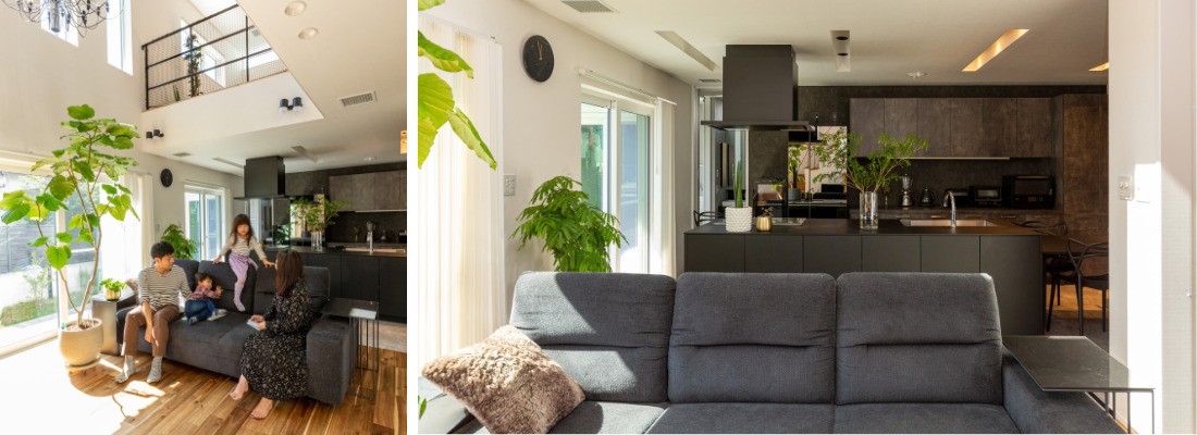 キッチンを中心に吹抜けでつながるリビングでくつろぐ家族の様子。大きな窓と観葉植物が映える、吹抜けのある明るいリビング空間