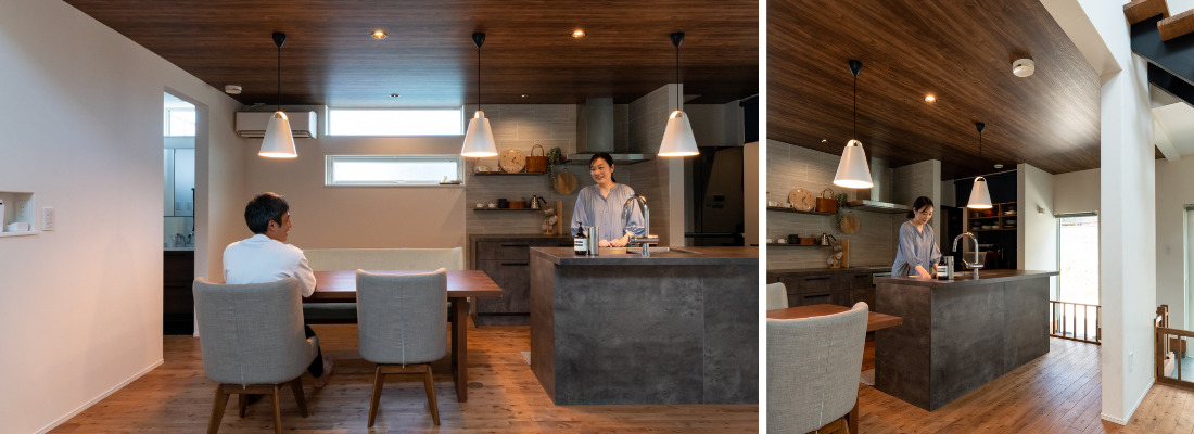 木目天井とペンダント照明が映える、モダンで落ち着いたダイニングキッチン。Ⅱ型キッチンと間接照明で洗練された雰囲気のキッチンスペース