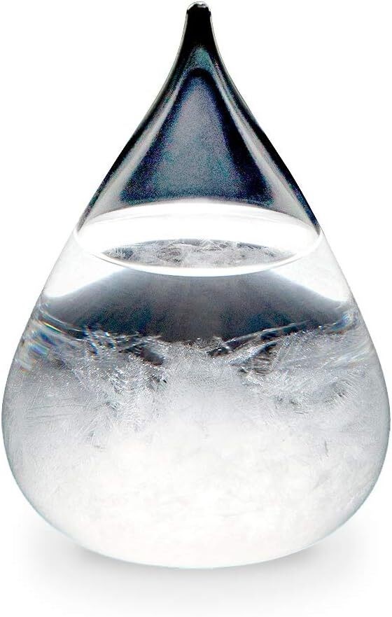 しずく型のガラス容器に入ったテンポドロップ。内部に白く美しい結晶が広がっている