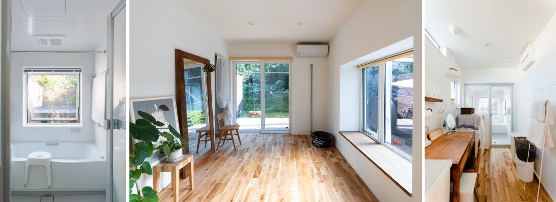 大きな窓から緑を望める、中二階に配置した浴室。庭に面した窓と木の床が心地よい、多目的に使える室内空間。窓から光が入る、横並びで使える洗面スペース。